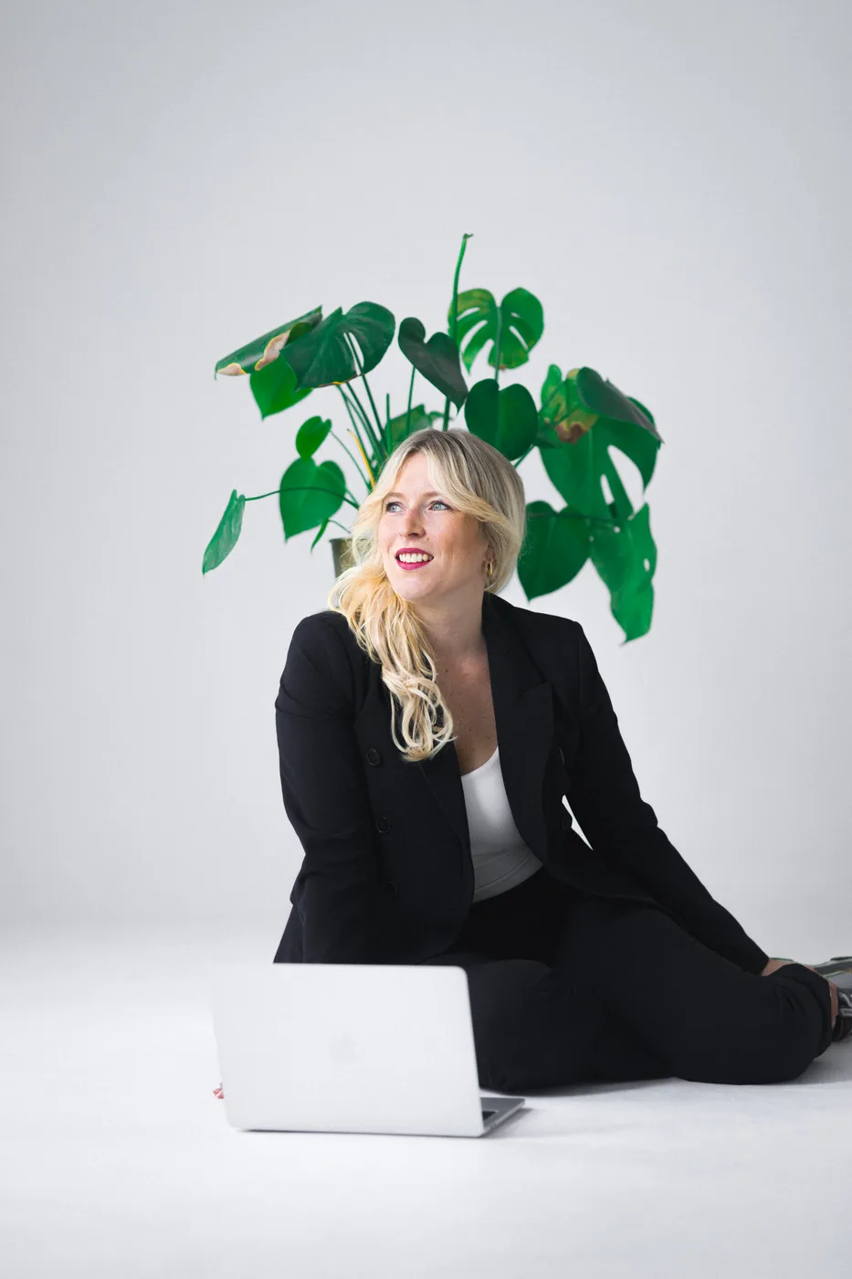 Personal branding portrait of a professional with a laptop in a Barcelona studio