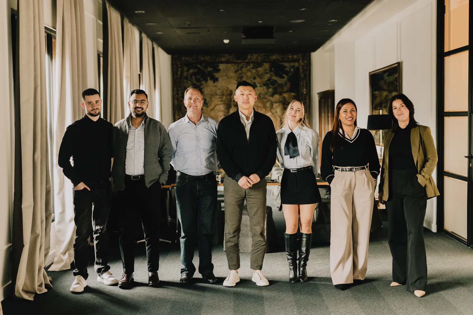 Company team group photograph in an office corridor in Barcelona